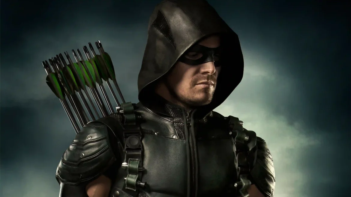 A cinematic 4K wallpaper of Stephen Amell as Oliver Queen from the Arrow TV series, wearing his tactical green hood and mask with a quiver of arrows on his back against a stormy sky.
