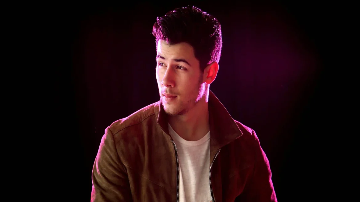 Nick Jonas 4K wallpaper with neon pink lighting and stylish portrait