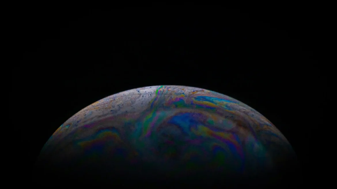 Colorful alien planet with iridescent atmospheric patterns floating in deep space against a dark cosmic background