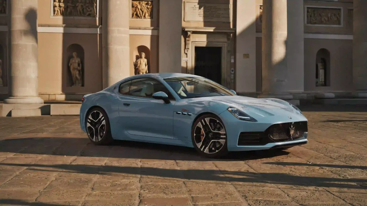 Light blue Maserati GranTurismo luxury sports car parked in front of historic architecture in 4K Ultra HD