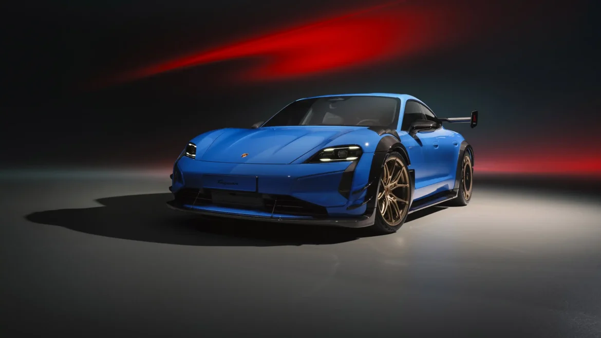 Blue Porsche Taycan Turbo GT with Manthey Kit under dramatic studio lighting in an Ultra HD 4K performance car wallpaper