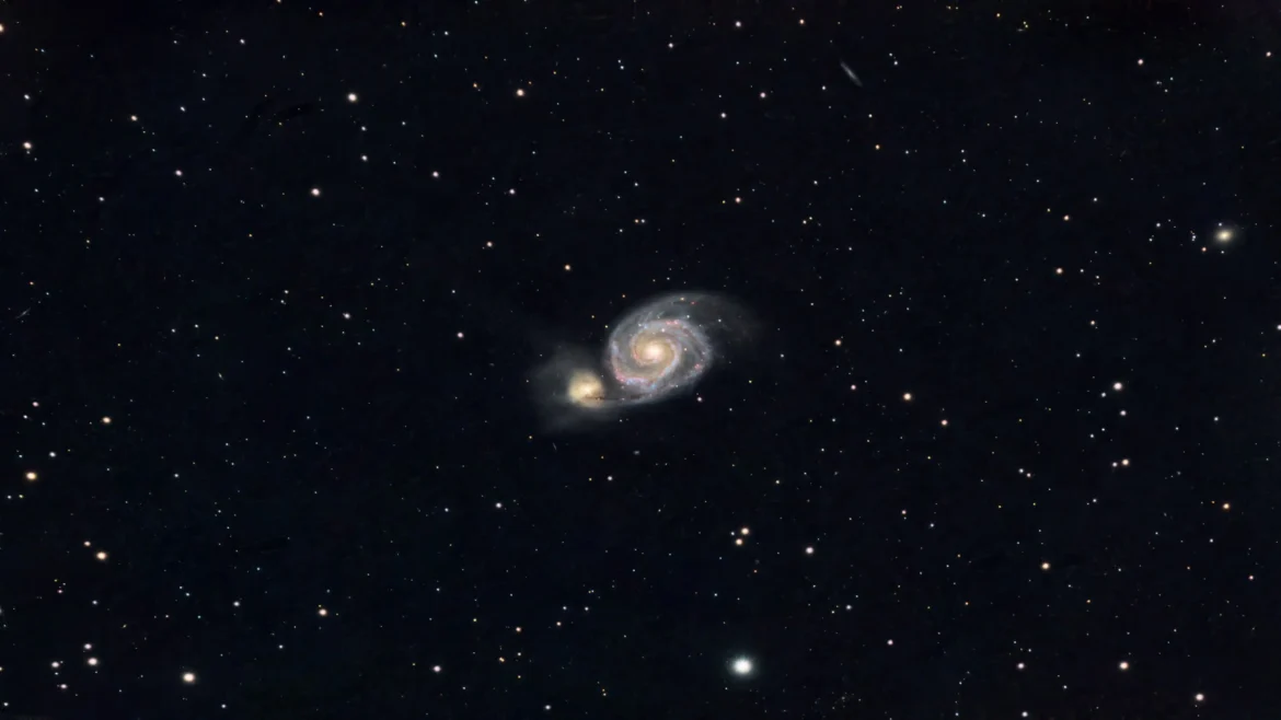 Whirlpool Galaxy with its companion galaxy surrounded by countless stars in breathtaking 4K deep space imagery