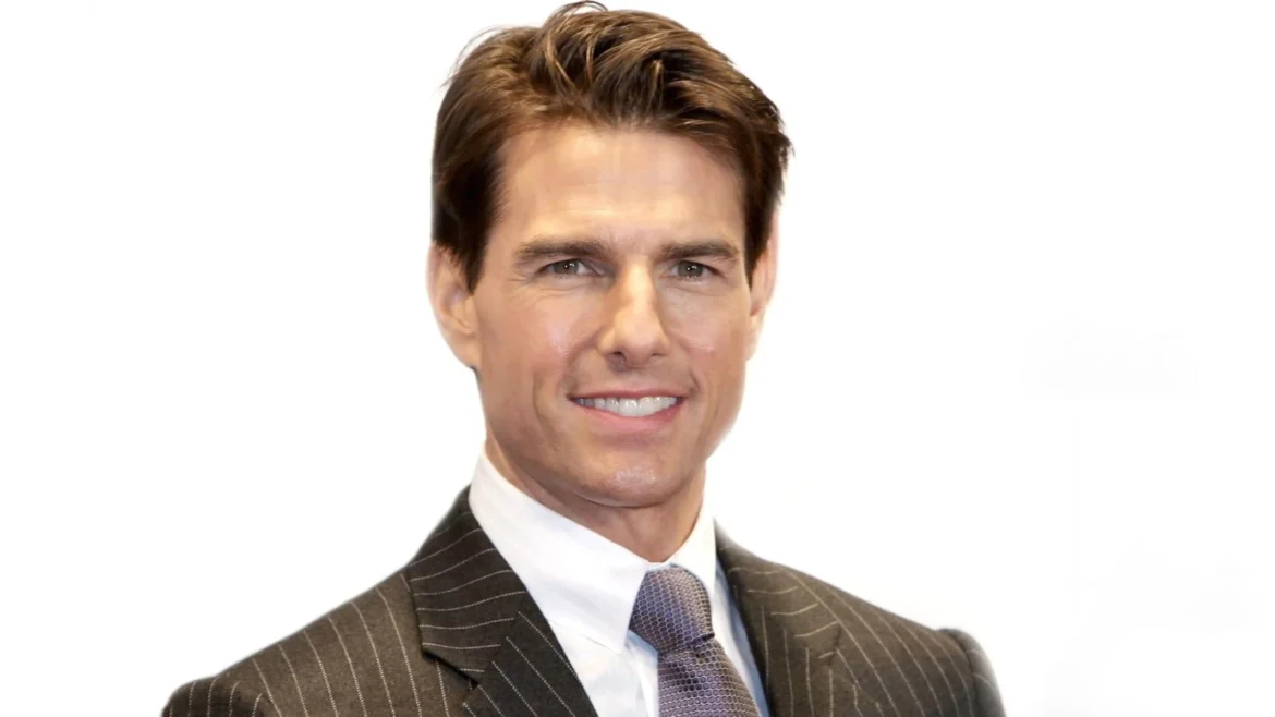 Studio portrait of Tom Cruise in a pinstripe suit with a clean background in an Ultra HD 4K celebrity wallpaper